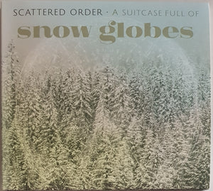 Scattered Order - A Suitcase Full Of Snow Globes