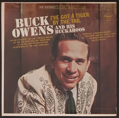 Buck Owens - I've Got A Tiger By The Tail